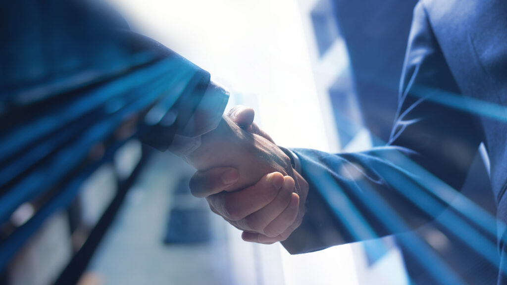 Business partners shaking hands
