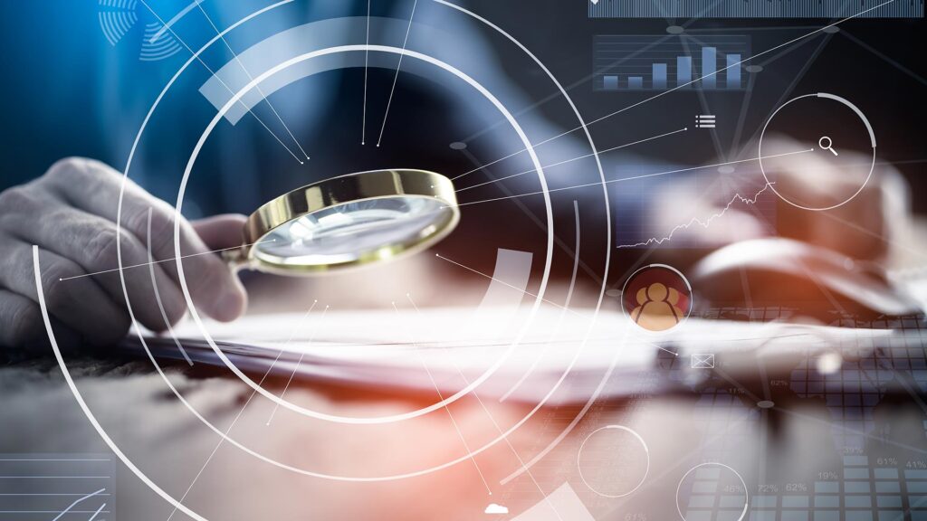 Business looking through magnifying glass at paper