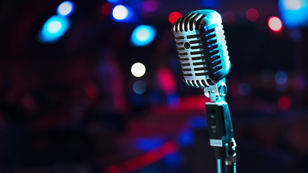 Retro microphone against blurred background