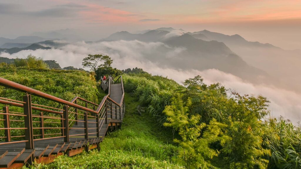 Landscape view of mountains in the clouds with a staircase going down