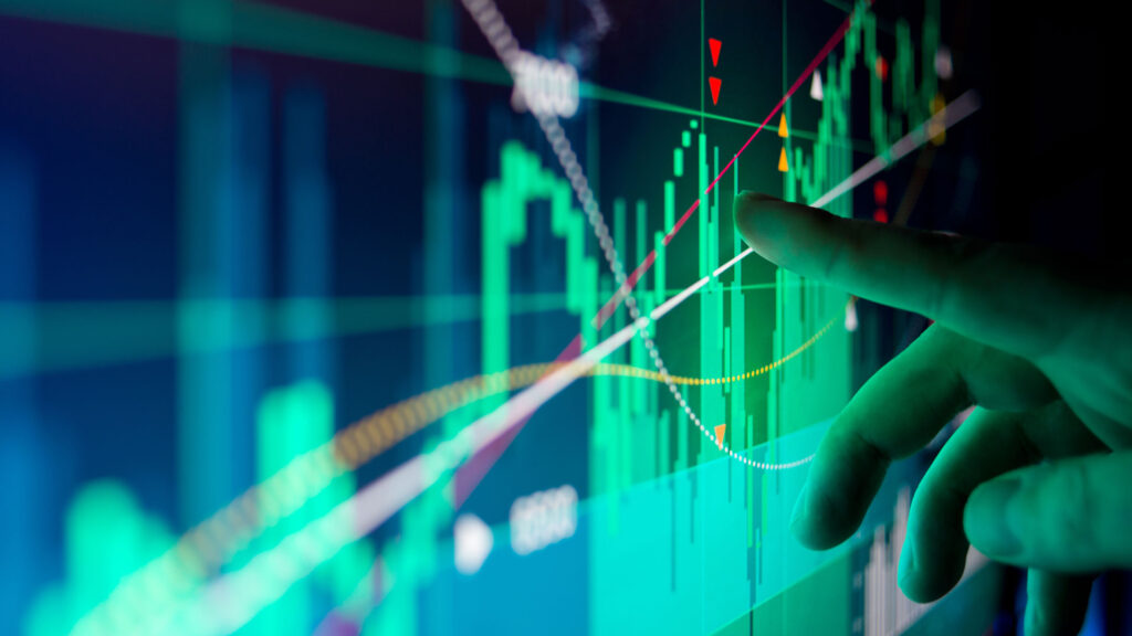 Person analysing stock market graph