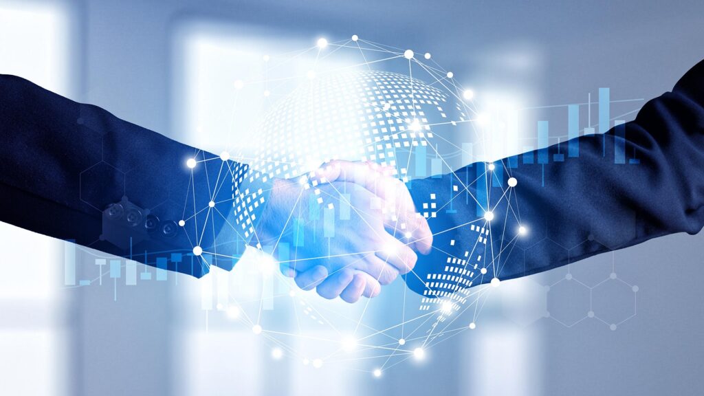 Business people shaking hands with a global stock graph in front