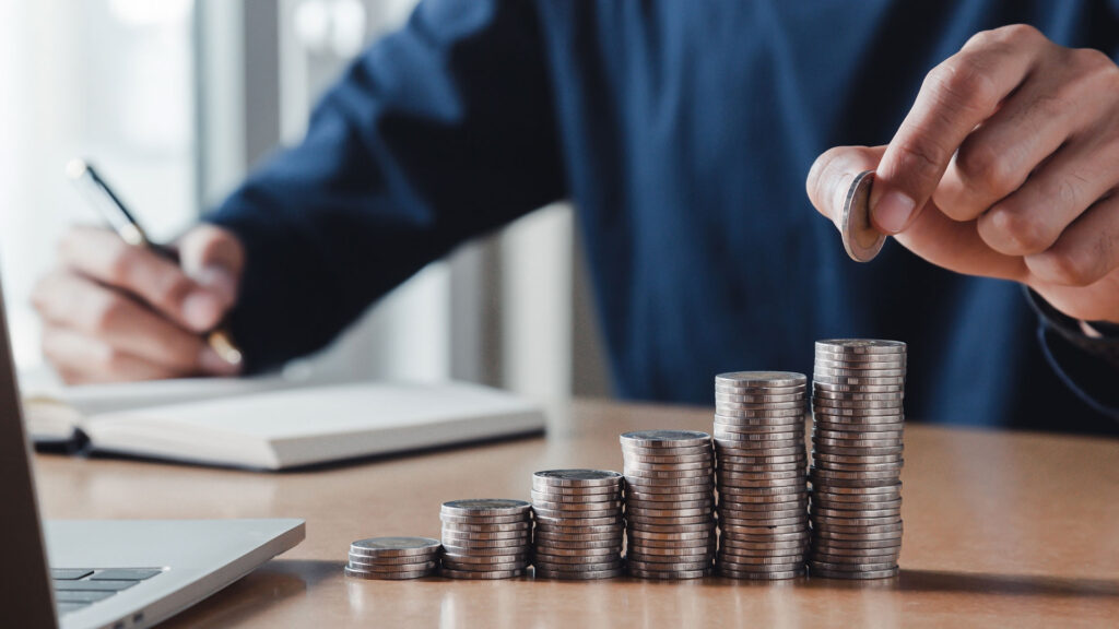 Person counting coins and increasing them