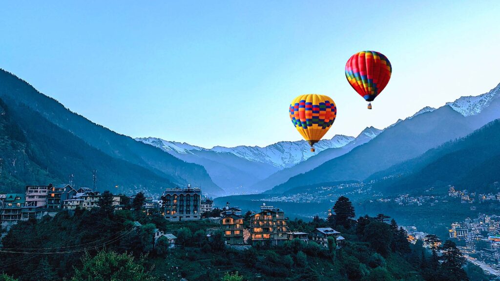 Two hot air balloons hovering over Manali, India
